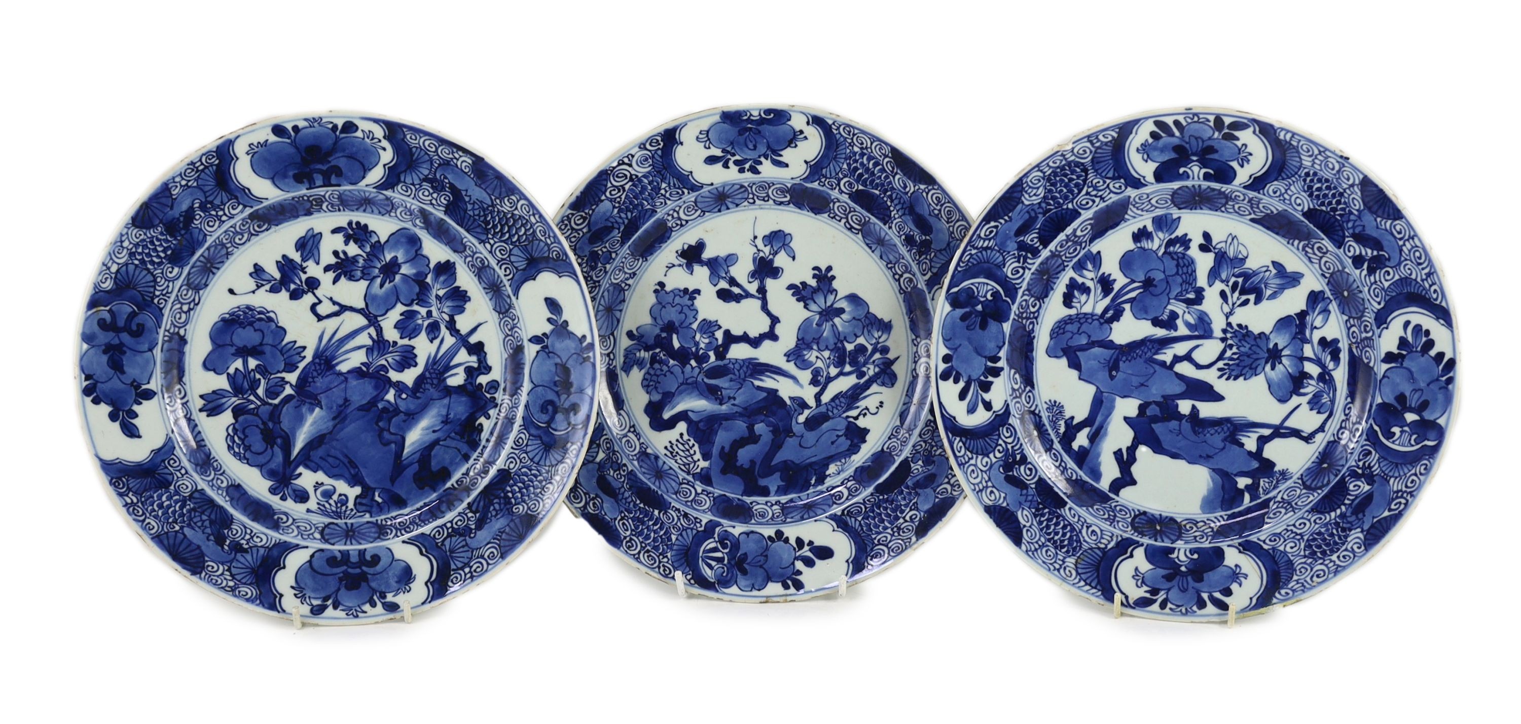 A set of three Chinese blue and white ‘pheasant’ large plates, Kangxi period, 28cm diameter, one repaired